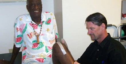 Wally (Famous Amos) being treated by his physical therapist.