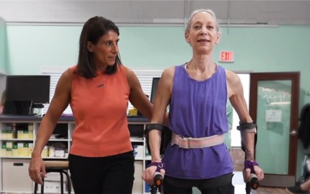 A dancer with a spinal cord injury with her physical therapist.