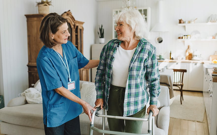 A PT helps show a patient safe use of a walker