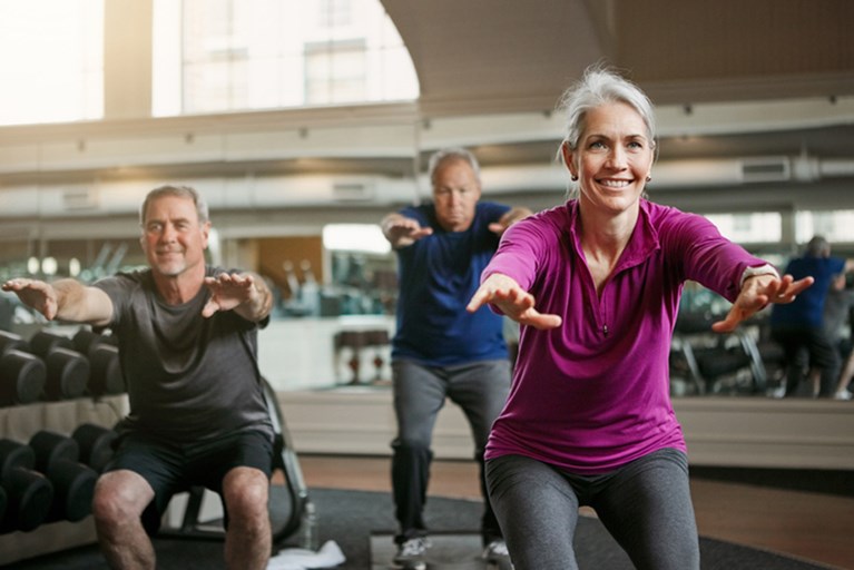 Older adults doing lower body strengthing exercises.