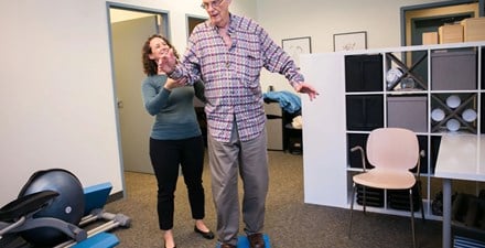 PT working with a person with Parkinson disease