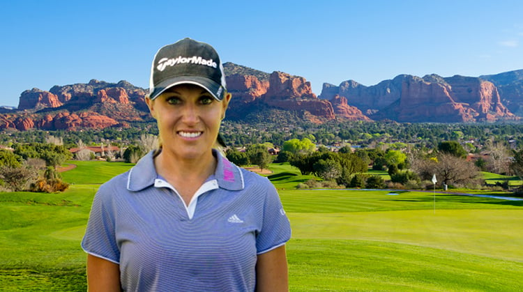 Natalie Gulbis, professional golfer, standing on a golf course.