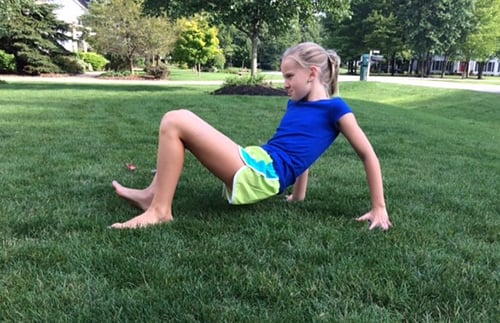 A child doing the crab walk