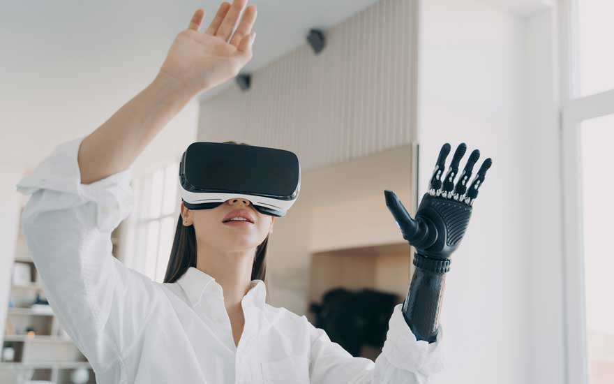 A women with a prosthetic hand using virtual reality during physical therapy