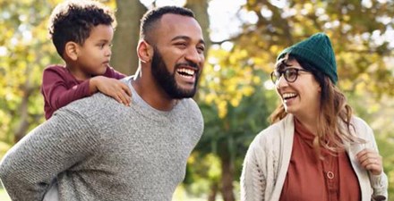 A family getting physical activity outdoors on video.