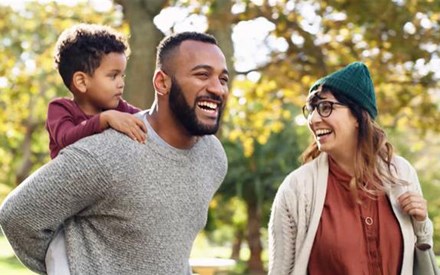 A family getting physical activity outdoors on video.