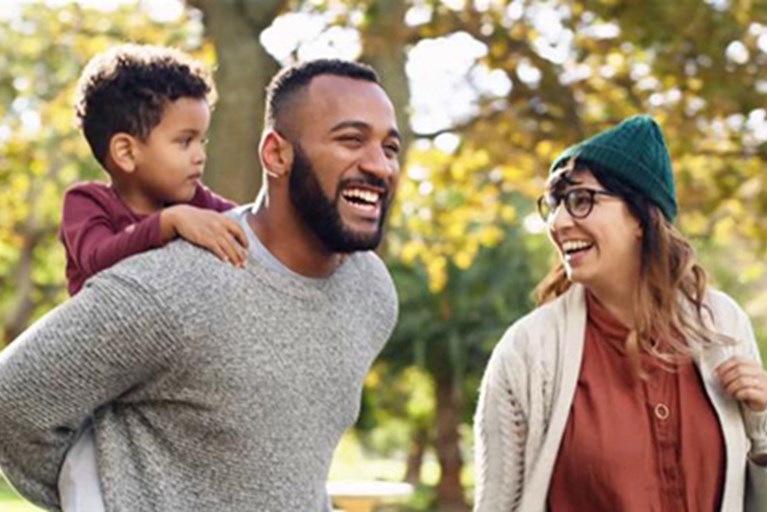 A family getting physical activity outdoors on video.