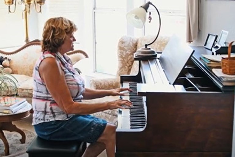 A woman playing the piano.