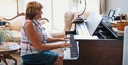 A woman playing the piano.