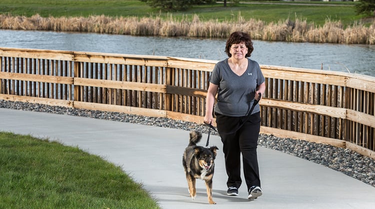 Louanne, walking with her dog outdoors