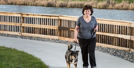 Louanne, walking with her dog outdoors