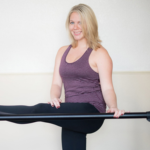 Morgan, with her foot on a ballet barre.