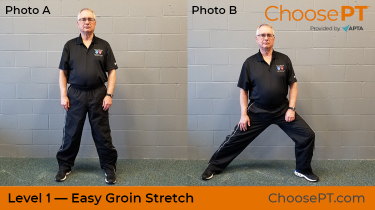 A physical therapist shows how to do a groin stretch.