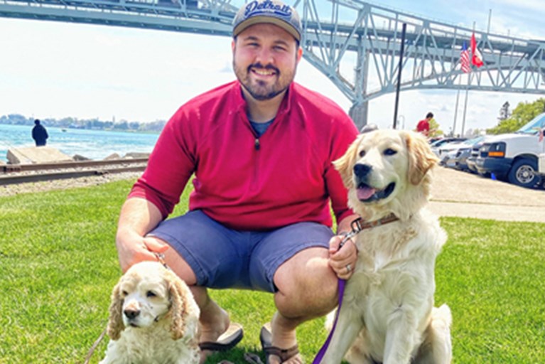 Ted DeChane, PT, DPT, outside with his dogs.