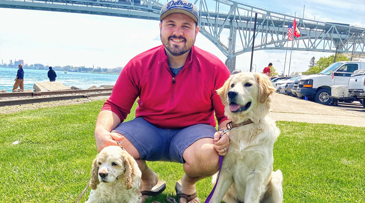 Ted Dechane, PT, DPT outside with his dogs