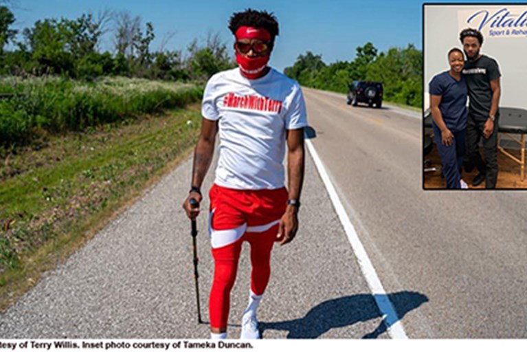 Terry Willis, a black man walking on the road during his 1,000-mile walk for justice.