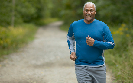 Adult man outside jogging