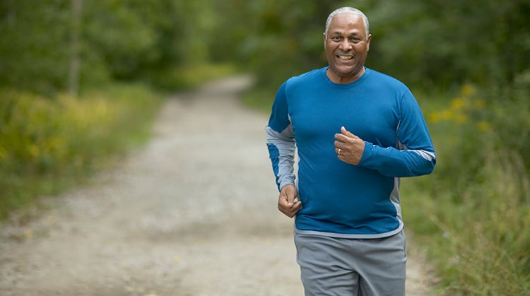 Adult man outside jogging