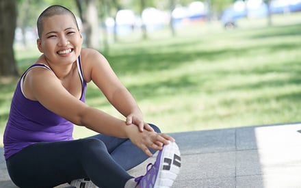 A patient with cancer doing stretching during exercise.