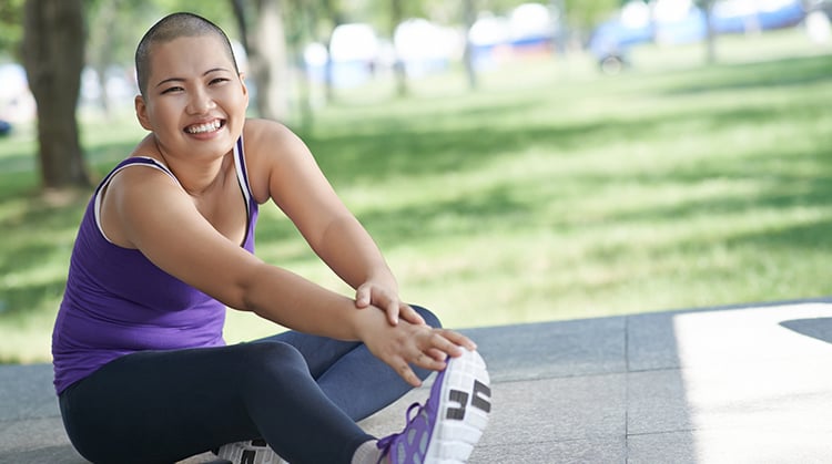 A patient with cancer doing stretching during exercise.