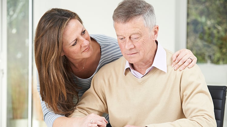 A confused man with his caregiver.