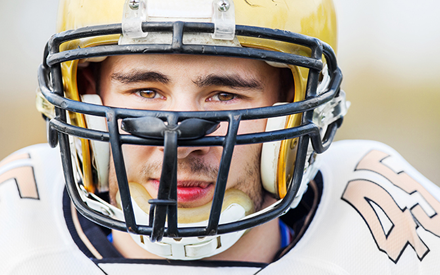 Football player wearing helmet.