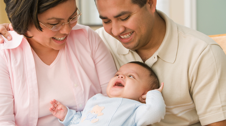 Parents holding their baby.