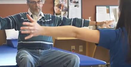 A man with Parkinson's disease doing physical therapy exercises.