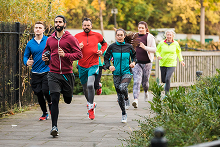 A group of people running outdoors.