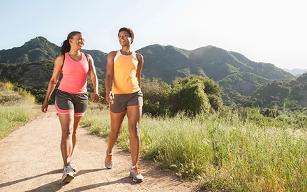 Two women walking outdoors.